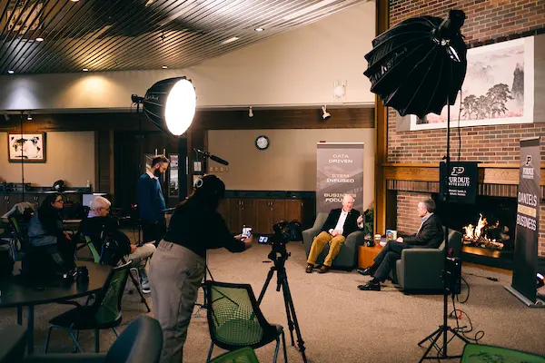 Mitch Daniels, President Emeritus of Purdue University, and Jim Bullard, Dr. Samuel R. Allen Dean of the Mitchell E. Daniels, Jr. School of Business, are filmed in the Weiler Lounge in 2024 discussing the future of the school
