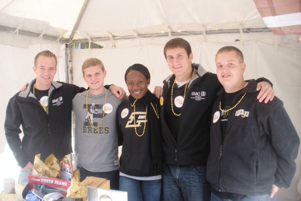 A group of Krannert Students at the homecoming tent