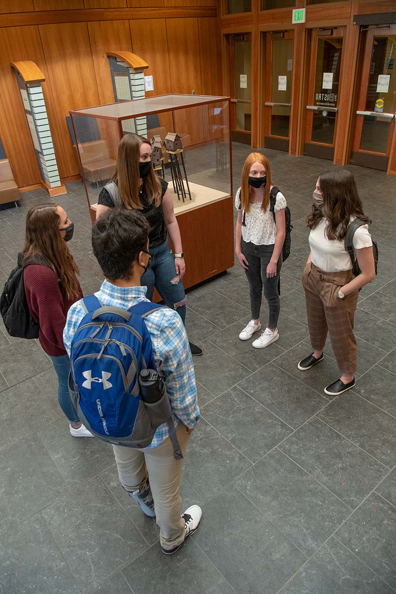 Students talk in the Rawls lobby