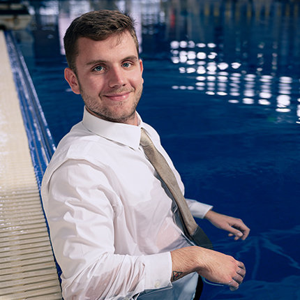 Kristian Komlenic sits in a pool